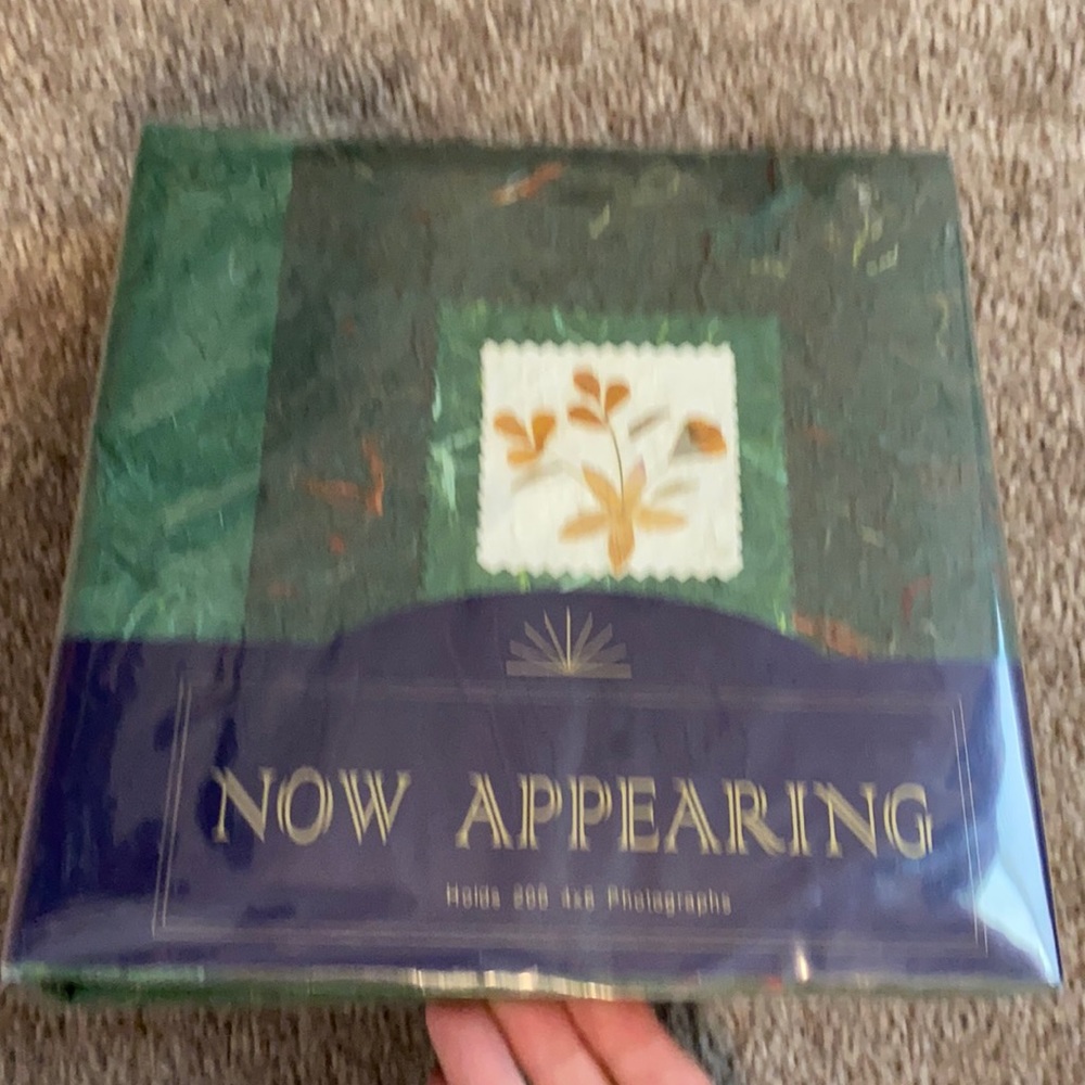 Photo album holds 200 4 by 6 photos - brand new